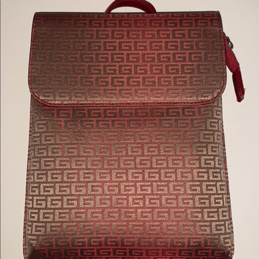 A red and (gold detailing) designer backpack!